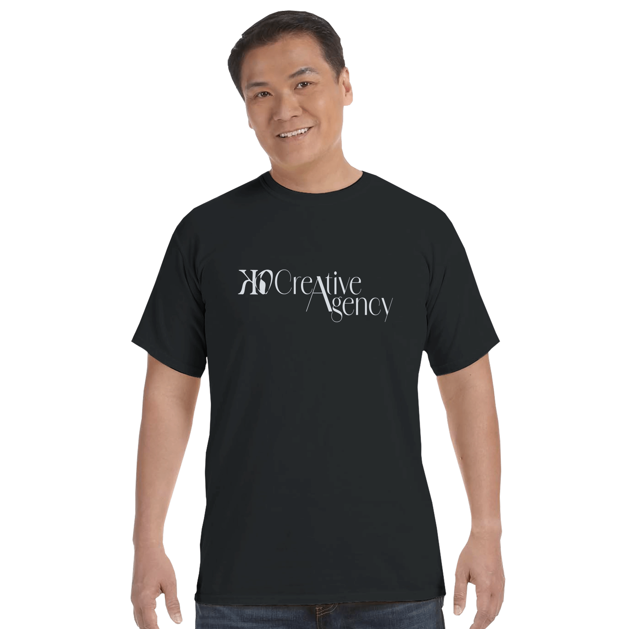 KO Creative Agency logo t-shirt in black with light blue print, shown on a unisex Comfort Colors tee.