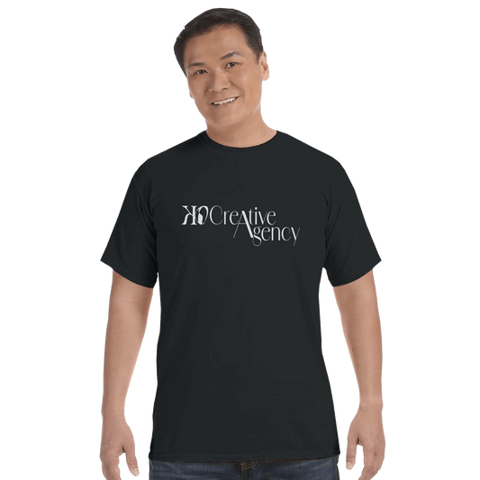 KO Creative Agency logo t-shirt in black with light blue print, shown on a unisex Comfort Colors tee.