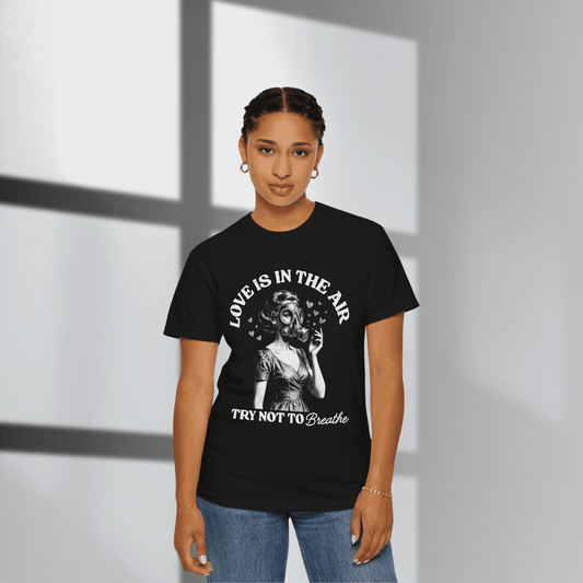 Person wearing a black t-shirt with a graphic design and text.