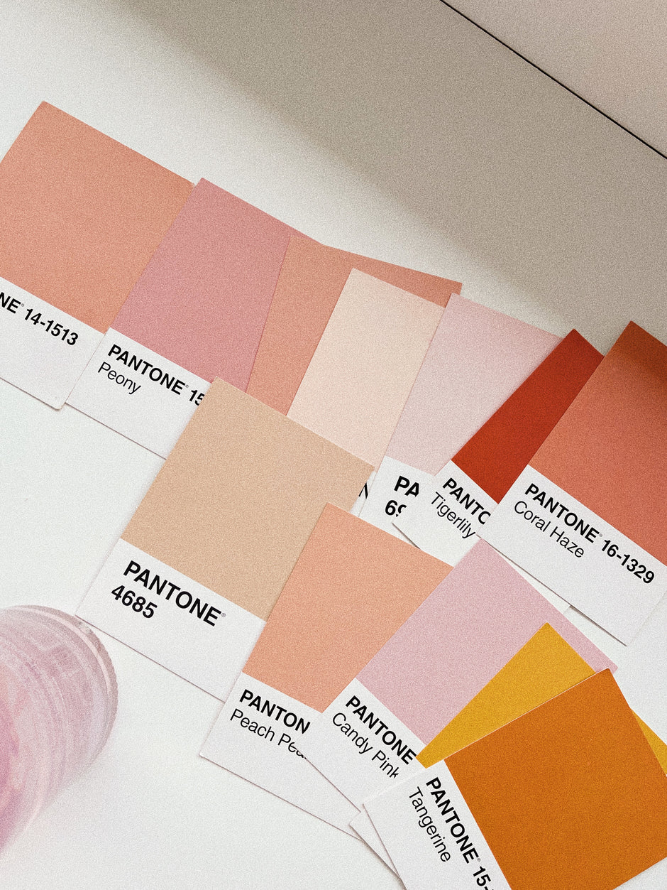 various pantone colors on a blank white table